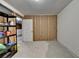 Spacious unfinished basement with a single door and some storage shelving at 4398 Stonebridge Ct, Duluth, GA 30096