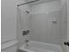 Bathroom with a white tiled shower and bathtub combination at 4398 Stonebridge Ct, Duluth, GA 30096