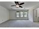 Large bedroom with new carpet, ceiling fan, and multiple windows at 4398 Stonebridge Ct, Duluth, GA 30096