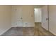 This cozy bedroom features neutral carpet, white walls, and a closet door at 4398 Stonebridge Ct, Duluth, GA 30096