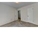Standard bedroom displaying neutral carpeting and doors with access to other areas at 4398 Stonebridge Ct, Duluth, GA 30096