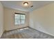 Unfurnished bedroom with neutral walls and carpeting with a window at 4398 Stonebridge Ct, Duluth, GA 30096