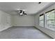 This spacious bedroom features new carpet, natural light, and a closet at 4398 Stonebridge Ct, Duluth, GA 30096