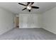 This spacious bedroom features new carpet, ceiling fan, and large closet at 4398 Stonebridge Ct, Duluth, GA 30096