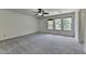 This spacious bedroom features new carpeting and ample natural light at 4398 Stonebridge Ct, Duluth, GA 30096