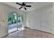 Bright eat-in kitchen features a slider to the backyard and a ceiling fan at 4398 Stonebridge Ct, Duluth, GA 30096