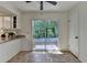Bright eat-in kitchen features a slider to the backyard at 4398 Stonebridge Ct, Duluth, GA 30096