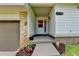Inviting front entrance featuring stone accents, neat landscaping, and visible house number at 4398 Stonebridge Ct, Duluth, GA 30096