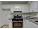 Bright traditional kitchen features white cabinets and stainless steel appliances at 4398 Stonebridge Ct, Duluth, GA 30096