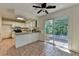 Traditional kitchen features white cabinets, granite countertops, and a slider to the backyard at 4398 Stonebridge Ct, Duluth, GA 30096