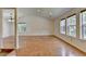 Bright and spacious living room featuring beautiful hardwood floors and vaulted ceiling with large windows at 4398 Stonebridge Ct, Duluth, GA 30096