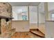 View of a living room area showcasing a stone fireplace and adjacent open rooms at 4398 Stonebridge Ct, Duluth, GA 30096
