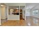 Spacious living room with wood floors adjacent to a stone fireplace and open floor plan at 4398 Stonebridge Ct, Duluth, GA 30096