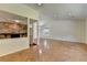 Open-concept living area featuring hardwood floors, a stone fireplace, and natural light at 4398 Stonebridge Ct, Duluth, GA 30096
