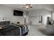 Spacious bedroom with a ceiling fan, large bed, and plenty of room for additional furniture at 7207 Gladstone Cir, Stonecrest, GA 30038