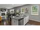 Bright kitchen island with granite countertops and stainless steel appliances. Windows overlooking yard at 7207 Gladstone Cir, Stonecrest, GA 30038