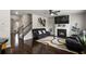 Elegant living room with dark wood floors, a fireplace, and comfortable seating for relaxation at 7207 Gladstone Cir, Stonecrest, GA 30038