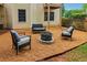 Cozy backyard seating area featuring a fire pit and comfortable outdoor furniture at 1006 Amberton Ln, Powder Springs, GA 30127