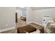 Finished basement with carpeted floor, seating area, and access to additional rooms at 1006 Amberton Ln, Powder Springs, GA 30127