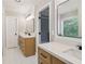 Stylish bathroom boasting double vanity, modern fixtures, and plenty of storage in wood cabinetry at 1006 Amberton Ln, Powder Springs, GA 30127