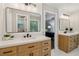 This bathroom features dual sinks, modern hardware, and a doorway to the bedroom at 1006 Amberton Ln, Powder Springs, GA 30127