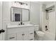 Bathroom with white vanity, black hardware and fixtures and a shower-tub combination at 1006 Amberton Ln, Powder Springs, GA 30127