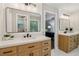 Bathroom featuring double sink vanity, quartz countertops and modern fixtures at 1006 Amberton Ln, Powder Springs, GA 30127
