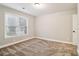 Bright bedroom features neutral walls and plush carpet, providing a blank canvas for personalization and relaxation at 1006 Amberton Ln, Powder Springs, GA 30127