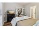 Relaxing bedroom featuring wood floors and a decorative fireplace with french doors to the stairway at 1006 Amberton Ln, Powder Springs, GA 30127