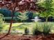 Tranquil park with a serene pond and fountain surrounded by lush foliage at 1006 Amberton Ln, Powder Springs, GA 30127