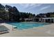 Community pool with ample seating and shaded pergola, perfect for relaxation at 1006 Amberton Ln, Powder Springs, GA 30127