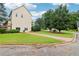 Home with a driveway and manicured lawn at 1006 Amberton Ln, Powder Springs, GA 30127
