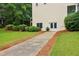 Double french doors on back of two-story home and large yard at 1006 Amberton Ln, Powder Springs, GA 30127