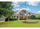 Beautiful two-story home with a mix of brick and siding, a covered front porch, and a lush green lawn at 1006 Amberton Ln, Powder Springs, GA 30127