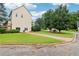 Exterior showing well-manicured lawn and a two-story house at 1006 Amberton Ln, Powder Springs, GA 30127