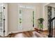 Inviting foyer with hardwood floors, a stylish front door, and views into the adjacent living spaces at 1006 Amberton Ln, Powder Springs, GA 30127