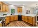 Well-lit kitchen features wood floors, updated countertops, and stainless steel appliances at 1006 Amberton Ln, Powder Springs, GA 30127