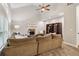 Bright and spacious living room featuring a stone fireplace, built-in shelving, and comfortable sectional sofa at 1006 Amberton Ln, Powder Springs, GA 30127