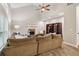 Cozy living room showcases plush sectional seating, fireplace, built-in shelving, and ample natural light at 1006 Amberton Ln, Powder Springs, GA 30127