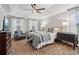 Serene main bedroom with tray ceiling, plush carpeting, neutral tones, and ample natural light at 1006 Amberton Ln, Powder Springs, GA 30127