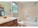 Clean and bright bathroom featuring a tub and shower combination with a single sink vanity at 1739 Brandy Woods Se Trl, Conyers, GA 30013