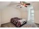 Bright bedroom featuring dormer windows, carpet, and neutral paint at 1739 Brandy Woods Se Trl, Conyers, GA 30013