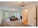 Bedroom with ample natural light, carpet, and spacious closets at 1739 Brandy Woods Se Trl, Conyers, GA 30013