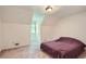 Cozy bedroom featuring dormer windows, carpet, and neutral paint at 1739 Brandy Woods Se Trl, Conyers, GA 30013