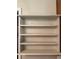 A built in cabinet featuring plain shelves for ample storage at 1739 Brandy Woods Se Trl, Conyers, GA 30013