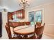 Cozy dining room featuring wood table and chairs and backyard views through sliding glass doors at 1739 Brandy Woods Se Trl, Conyers, GA 30013