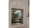 A mirrored display cabinet with glass shelves is an elegant storage solution at 1739 Brandy Woods Se Trl, Conyers, GA 30013