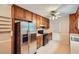 Well-lit kitchen featuring a full suite of appliances and classic cabinetry at 1739 Brandy Woods Se Trl, Conyers, GA 30013