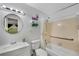 Full bathroom with a shower-tub combo, a single sink vanity, and a round mirror at 3428 Ivys Walk, Atlanta, GA 30340