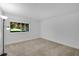 Cozy bedroom featuring a large window with natural lighting and plush carpet at 3428 Ivys Walk, Atlanta, GA 30340